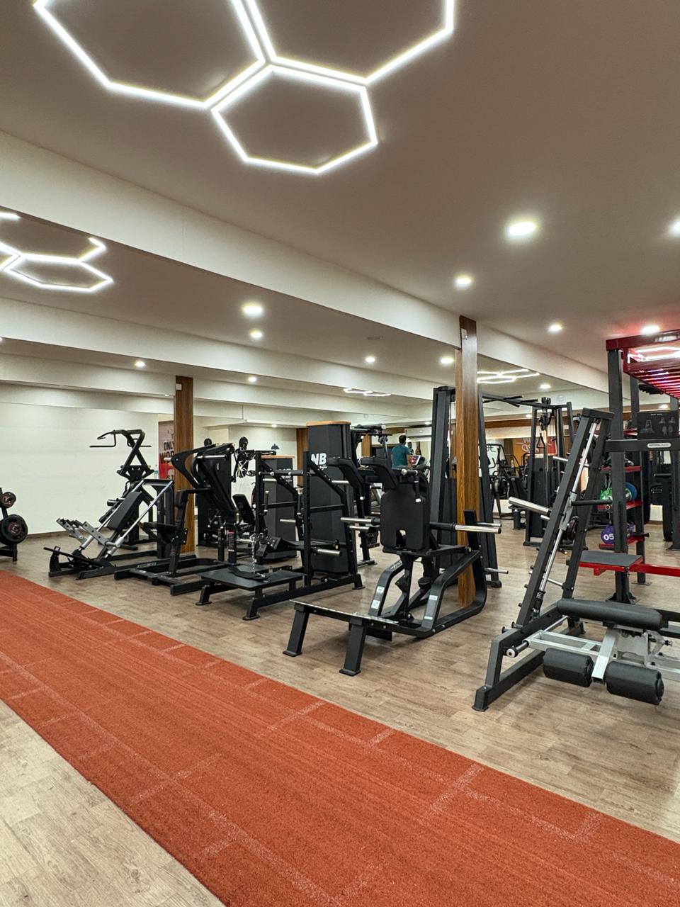 Inside Liger Fitness Vellimadukunnu - training area and premium equipment